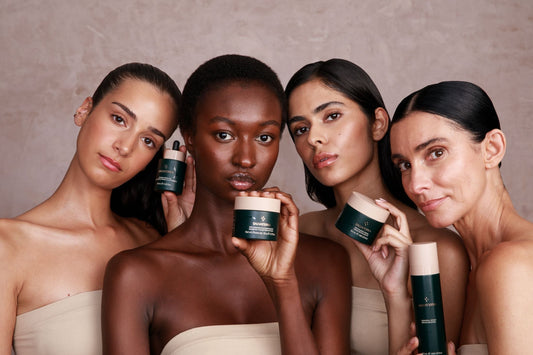 Four female models of various skin tones and ages, each holding a Salvaterra skincare product